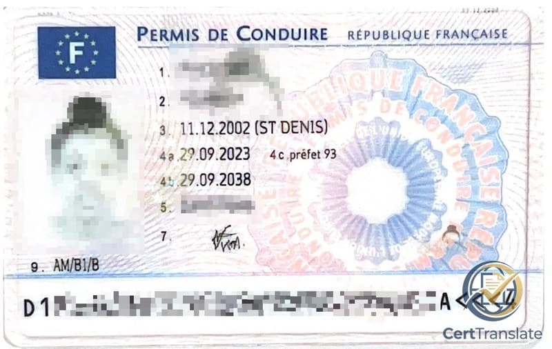 Front of a French driving license (permis de conduire) with personal details redacted, showing the holder's photo, the EU emblem, a security seal, and the machine-readable code strip at the bottom